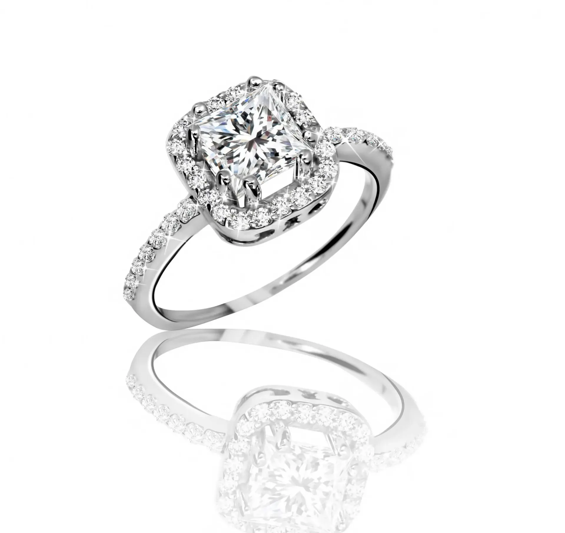 A princess-cut diamond halo engagement ring in white gold.
