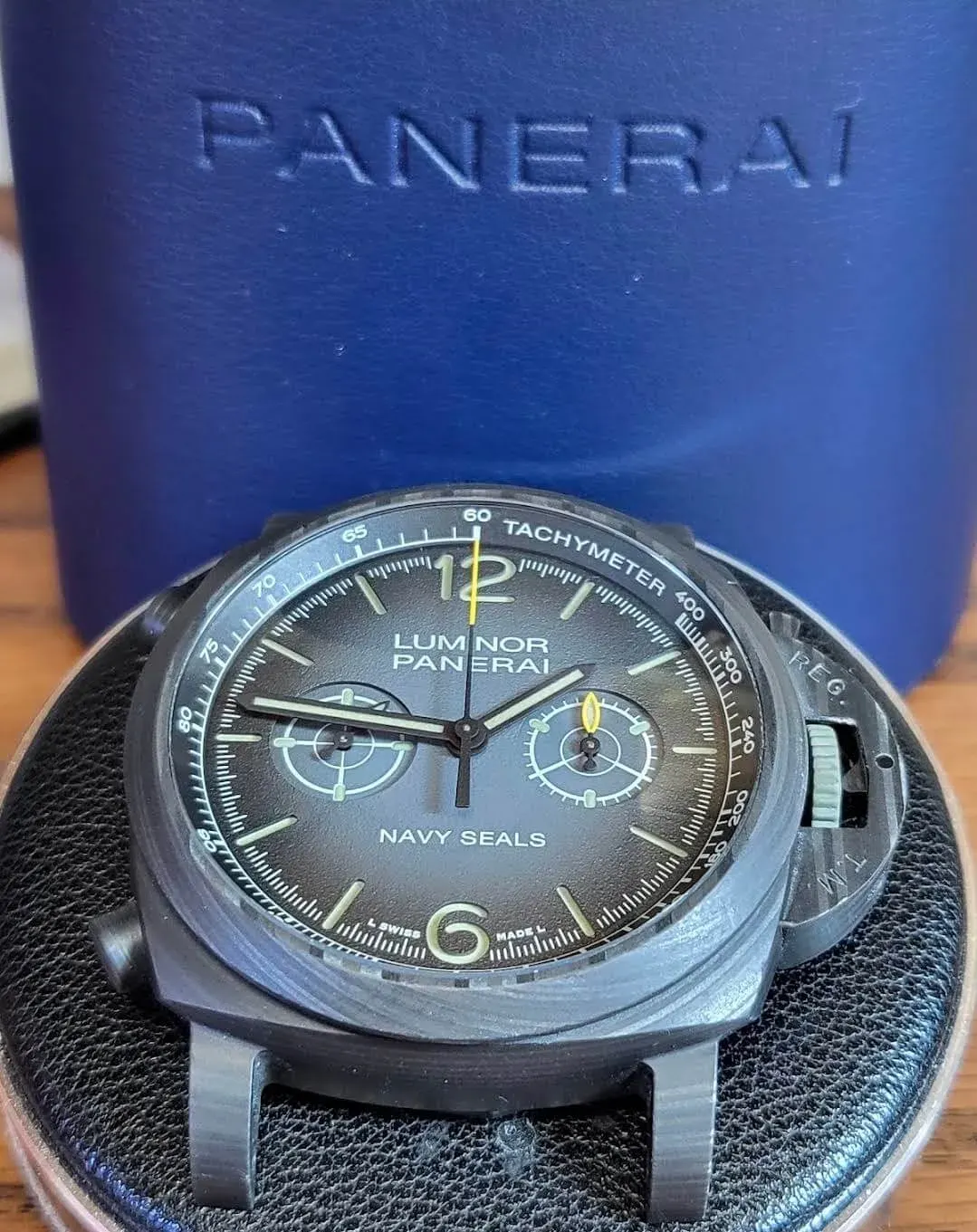 A Panerai Luminor chronograph resting in its presentation case after service.