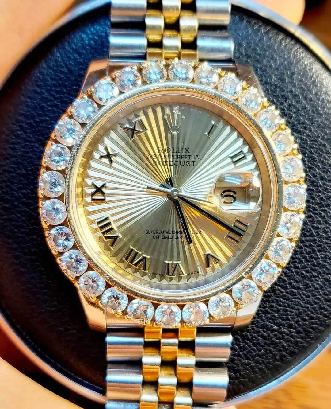 A two-tone Rolex Datejust with a diamond bezel, serviced in-house.