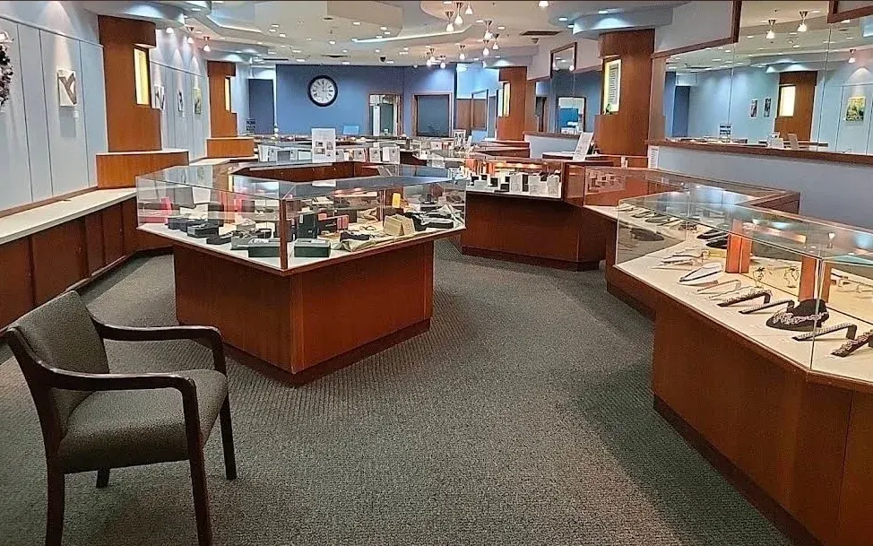 The Watch ProShop showroom with lit display cases inside Valley West Mall.